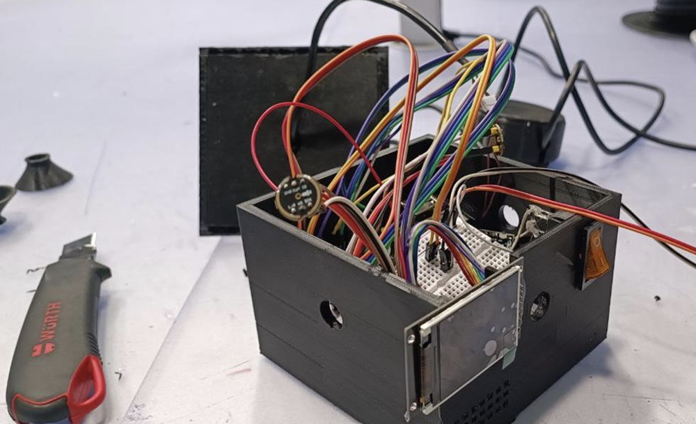 Open prototype enclosure showing wiring