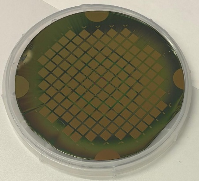 Gold-toned silicon wafer with square grid pattern
